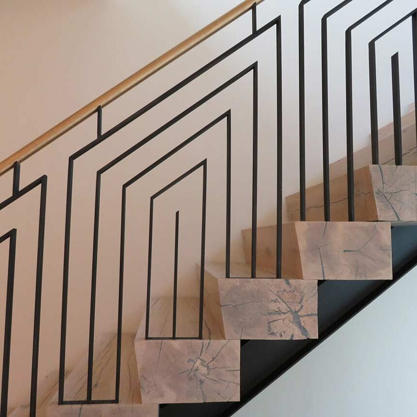 contemporary black and brass stair